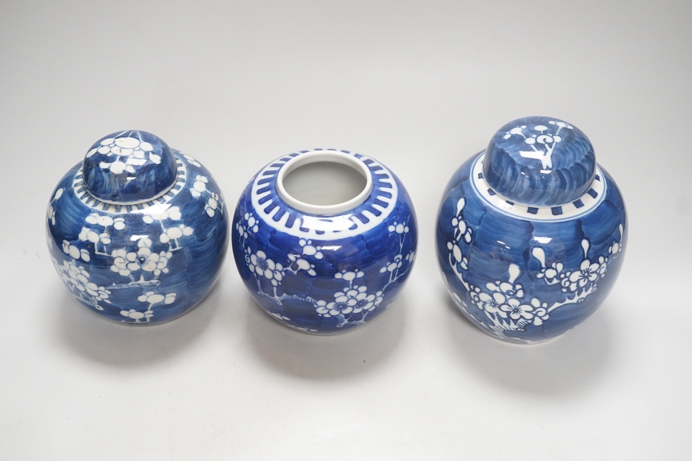 Three Chinese blue and white prunus jars, late 19th / early 20th century, tallest 16cm